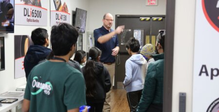 TyRex tours a student group around its facility